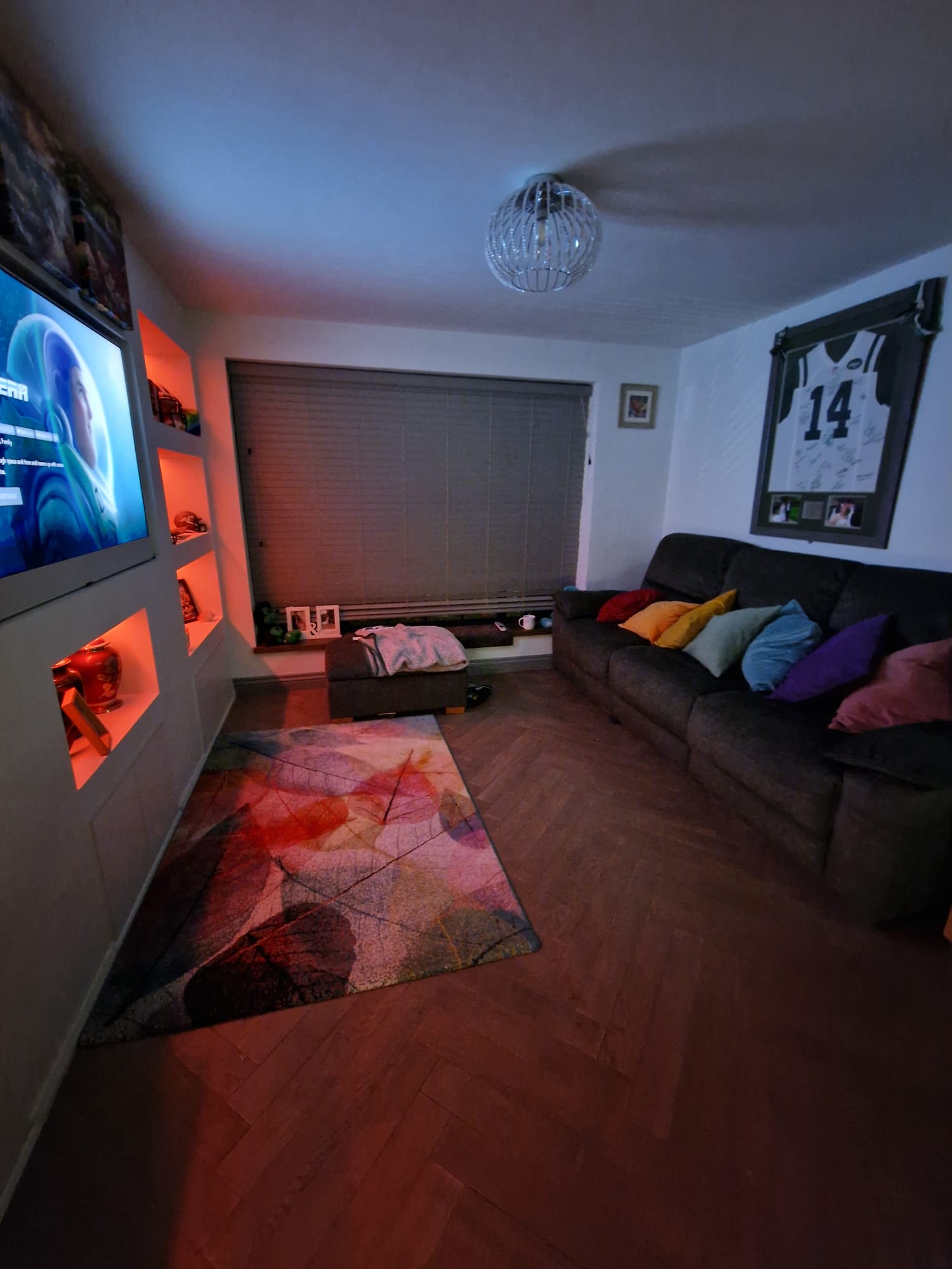 Media wall and living room with feature lighting