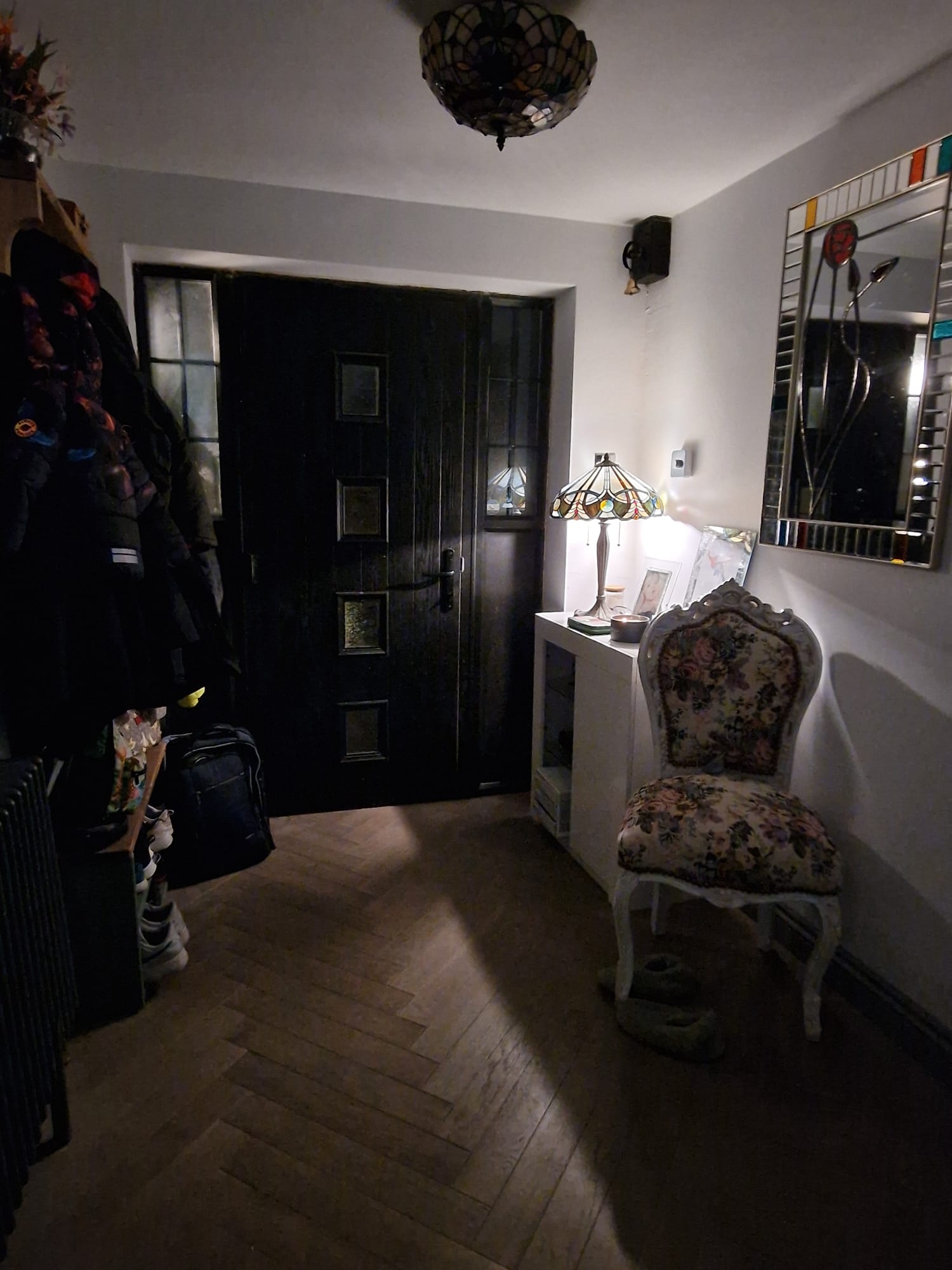 Hallway with fitted joinery and black door